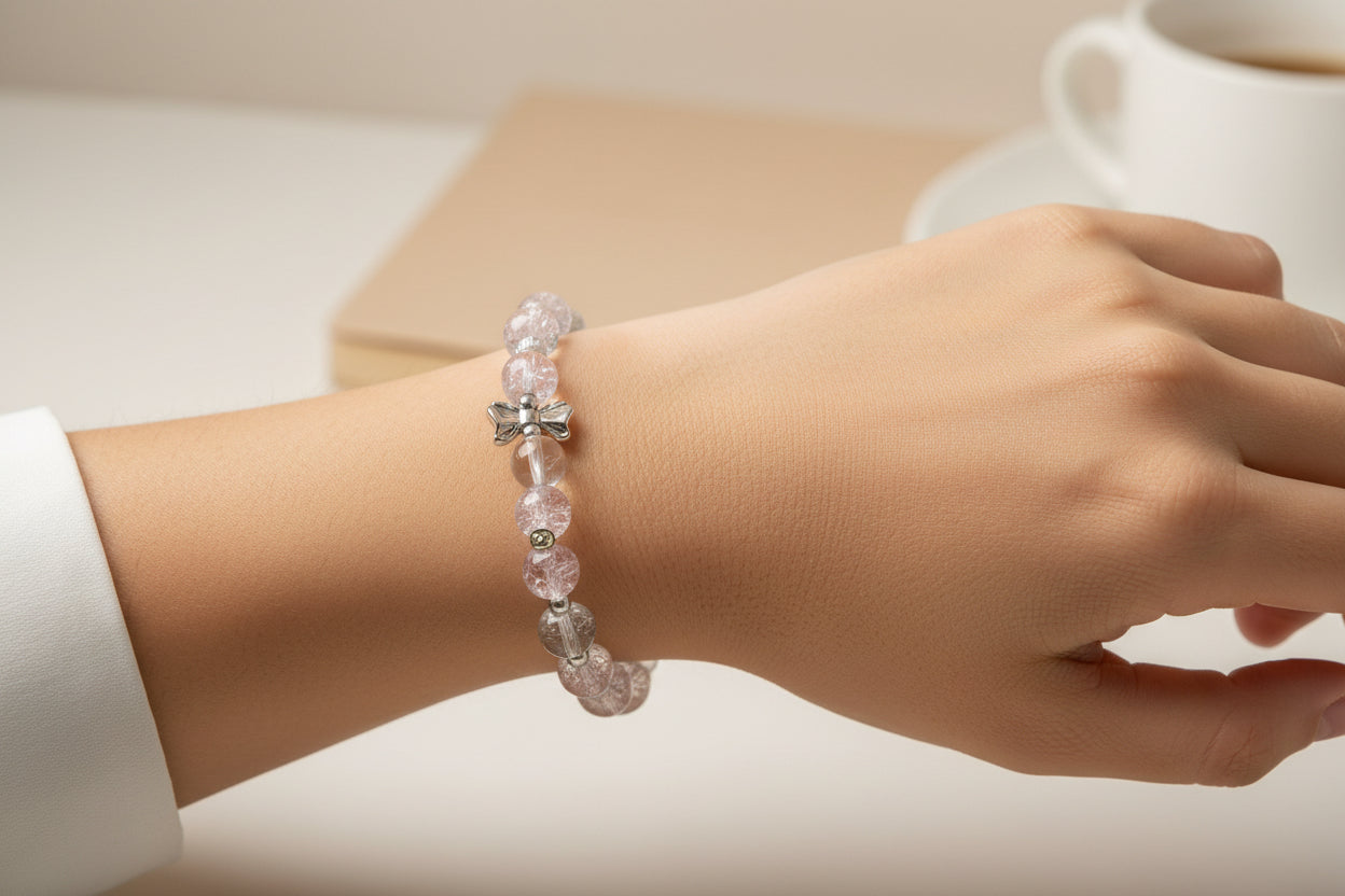 Bracelet with pink beads and silver charms