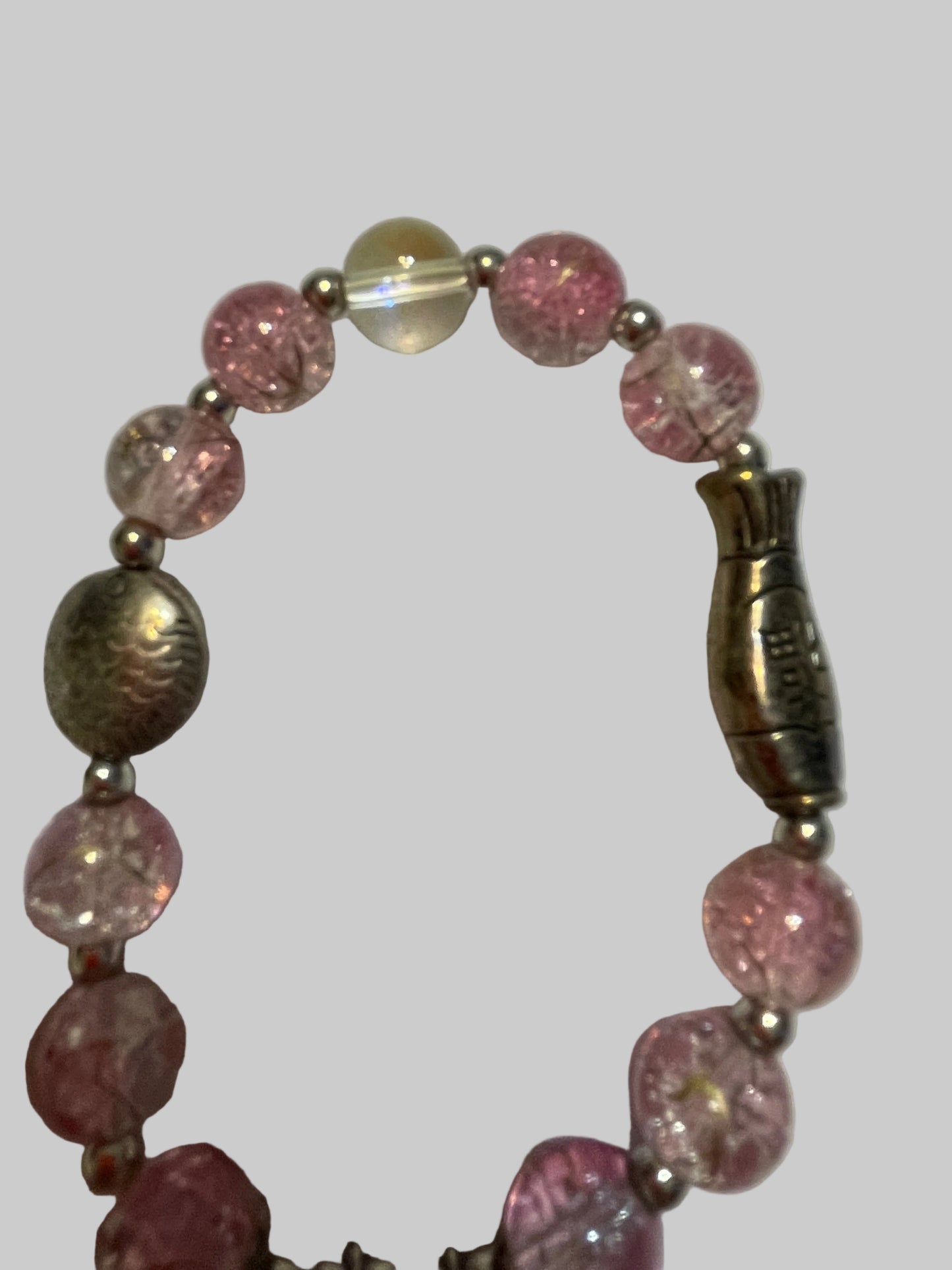 Bracelet with pink beads and metal clasp