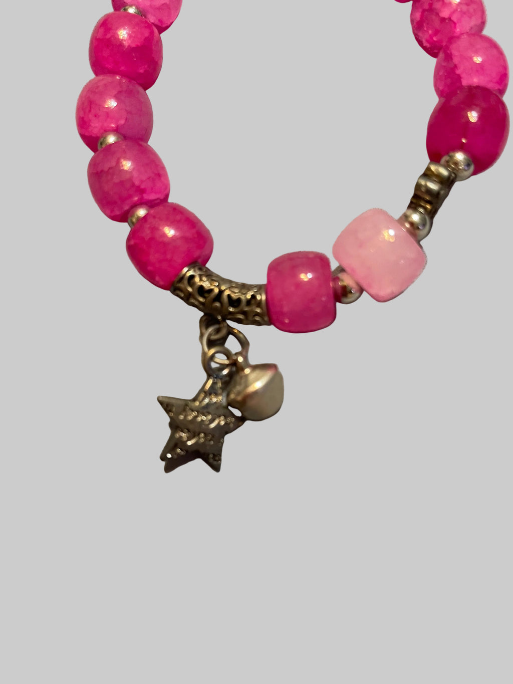 Pink bracelet with a star charmed