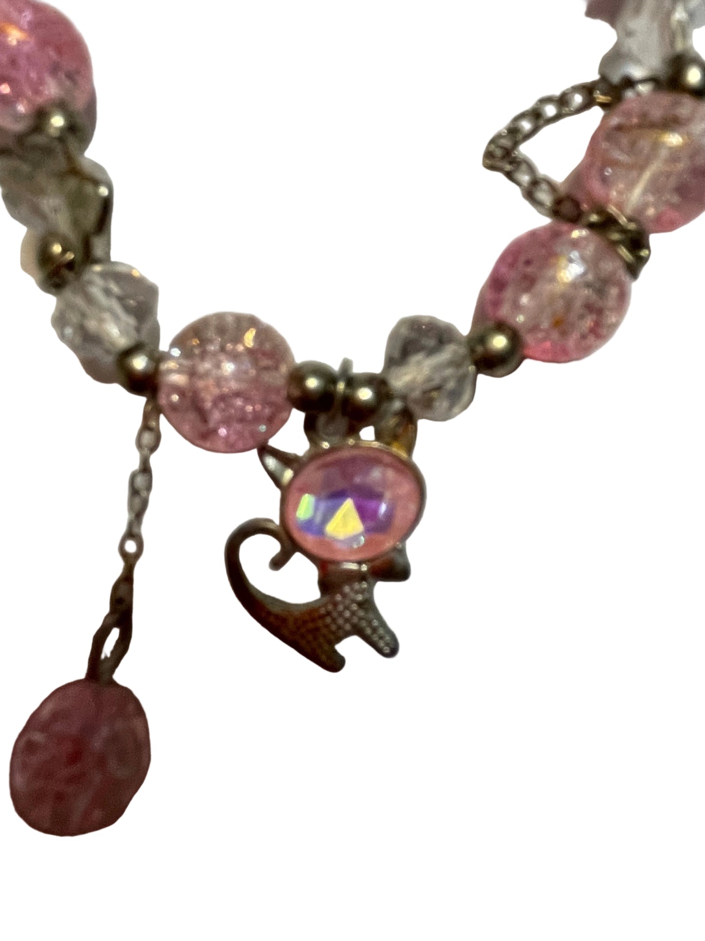 Bracelet with pink beads and a heart-shaped charm
