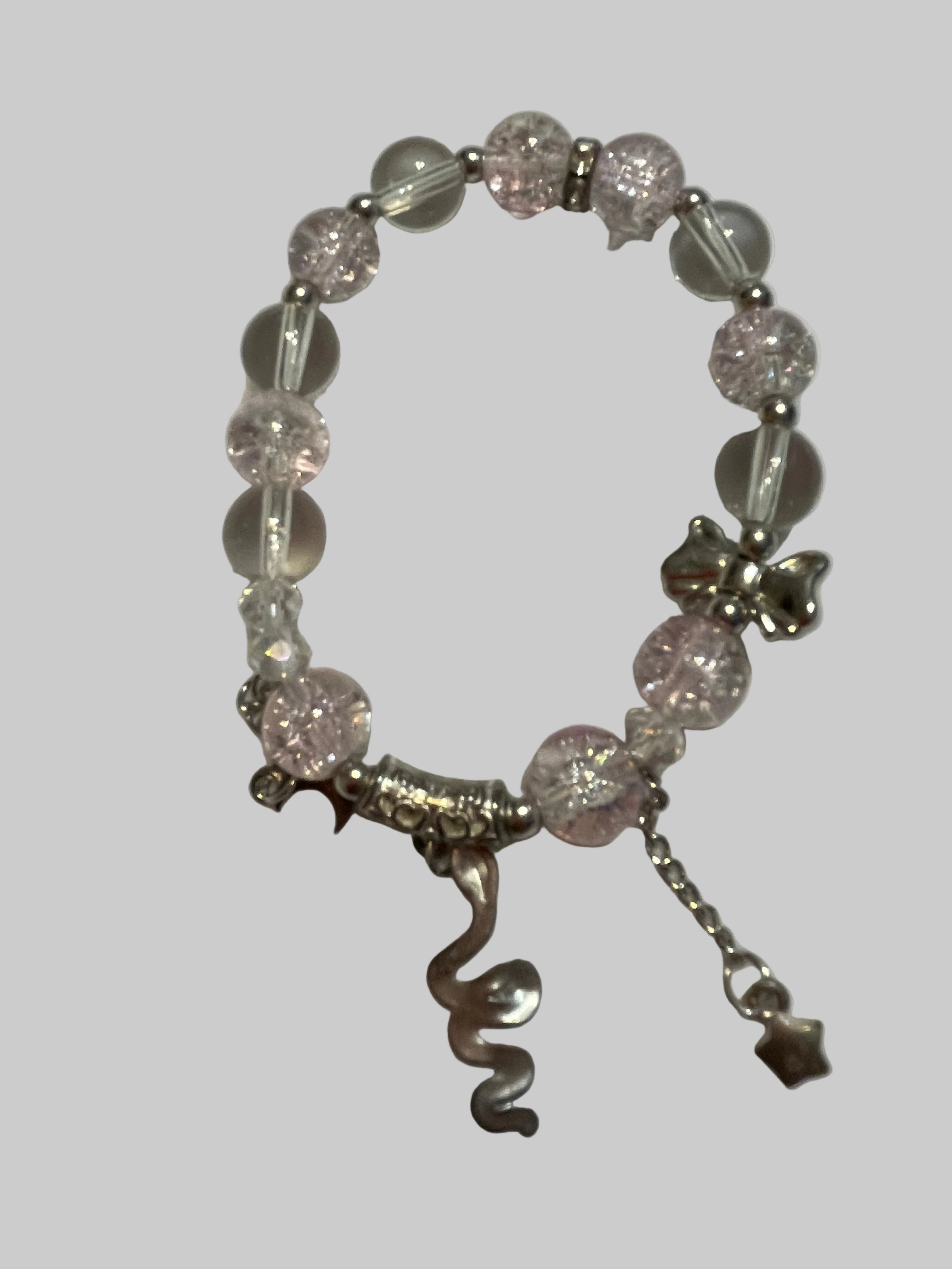 Bracelet with pink beads and silver charms