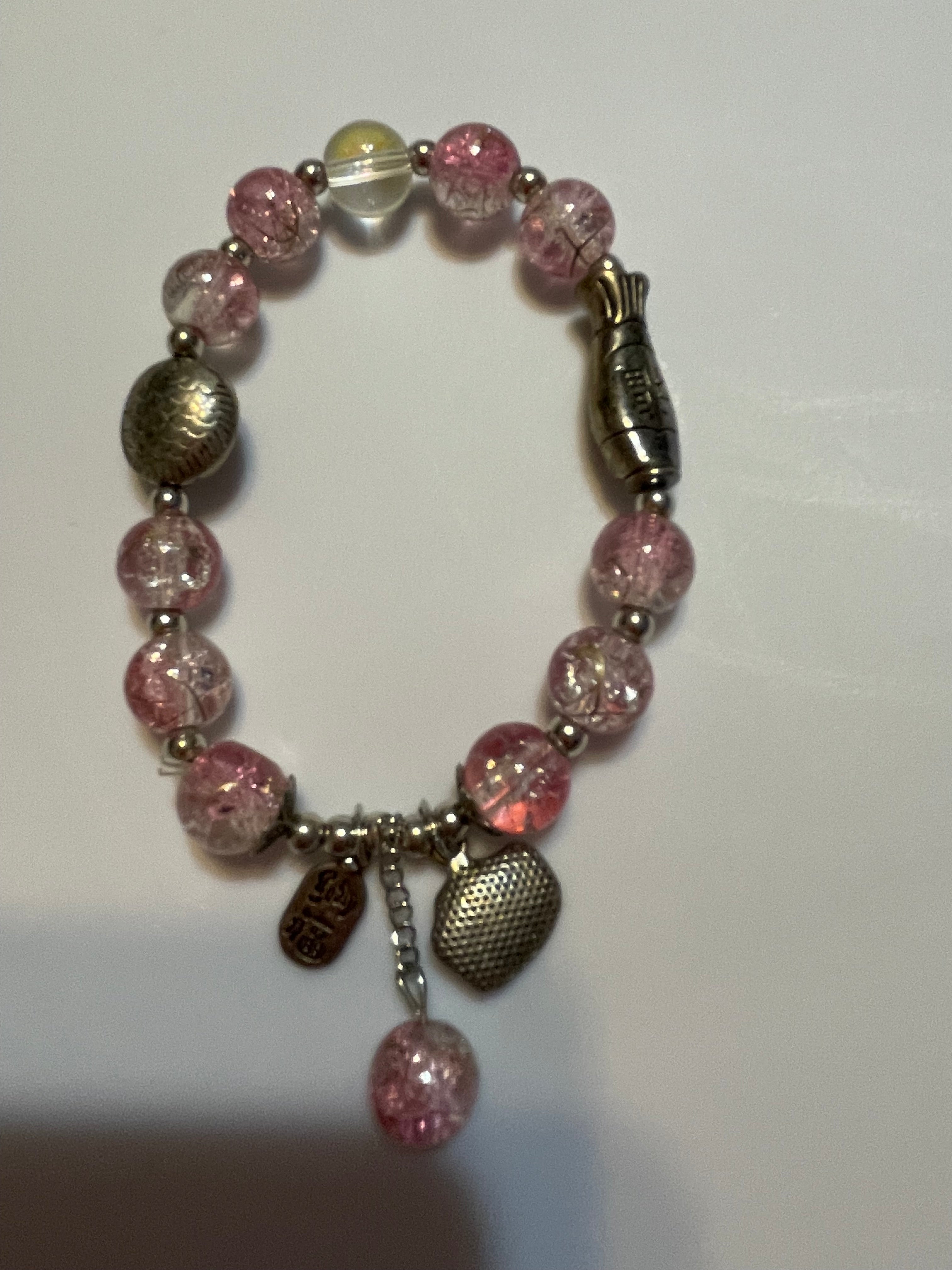 Bracelet with pink beads and metal clasp