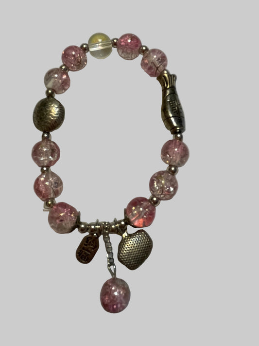 Bracelet with pink beads and metal clasp