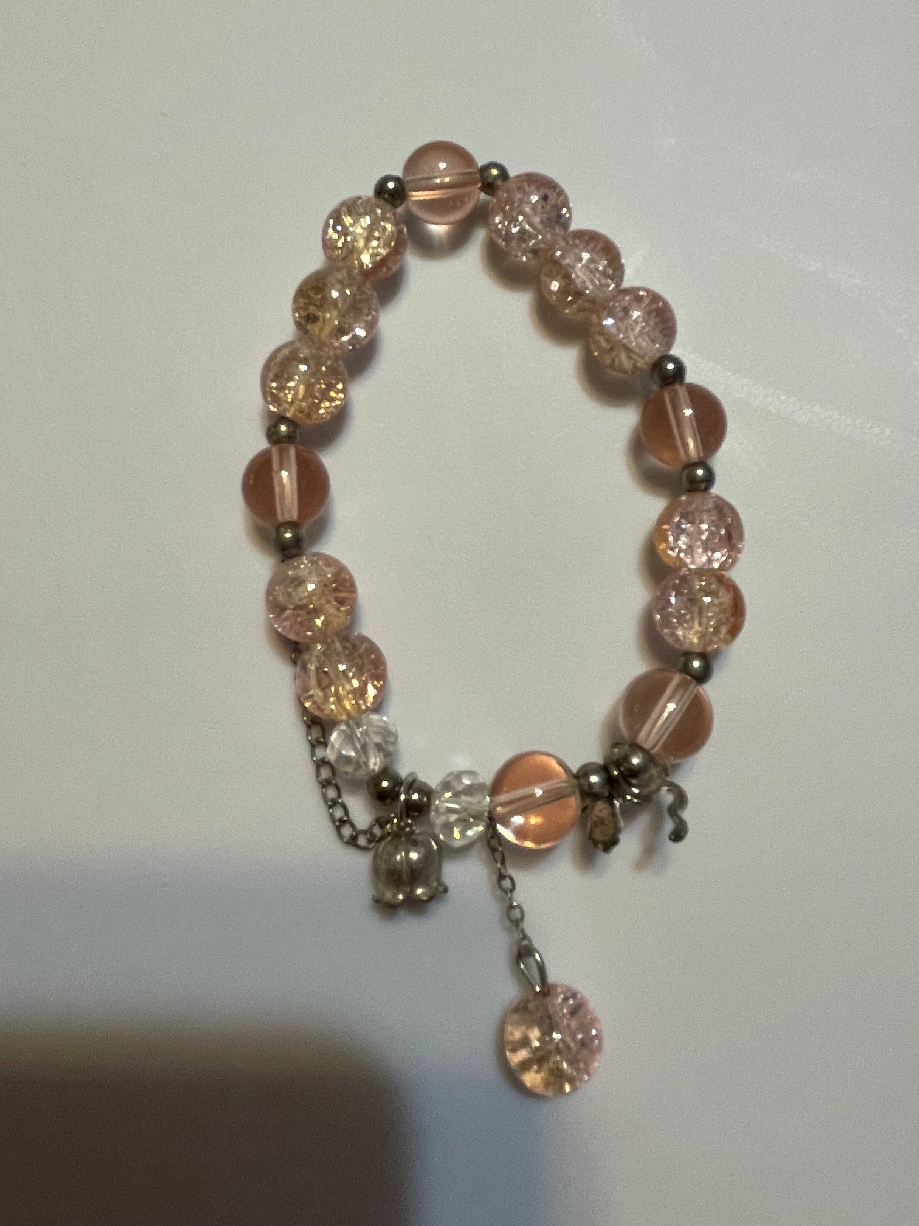 Bracelet with pink and clear beads.