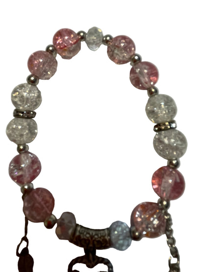 Bracelet with pink and clear beads and a 'LOVE' charm