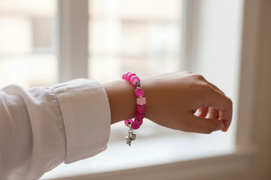 Pink bracelet with a star charmed