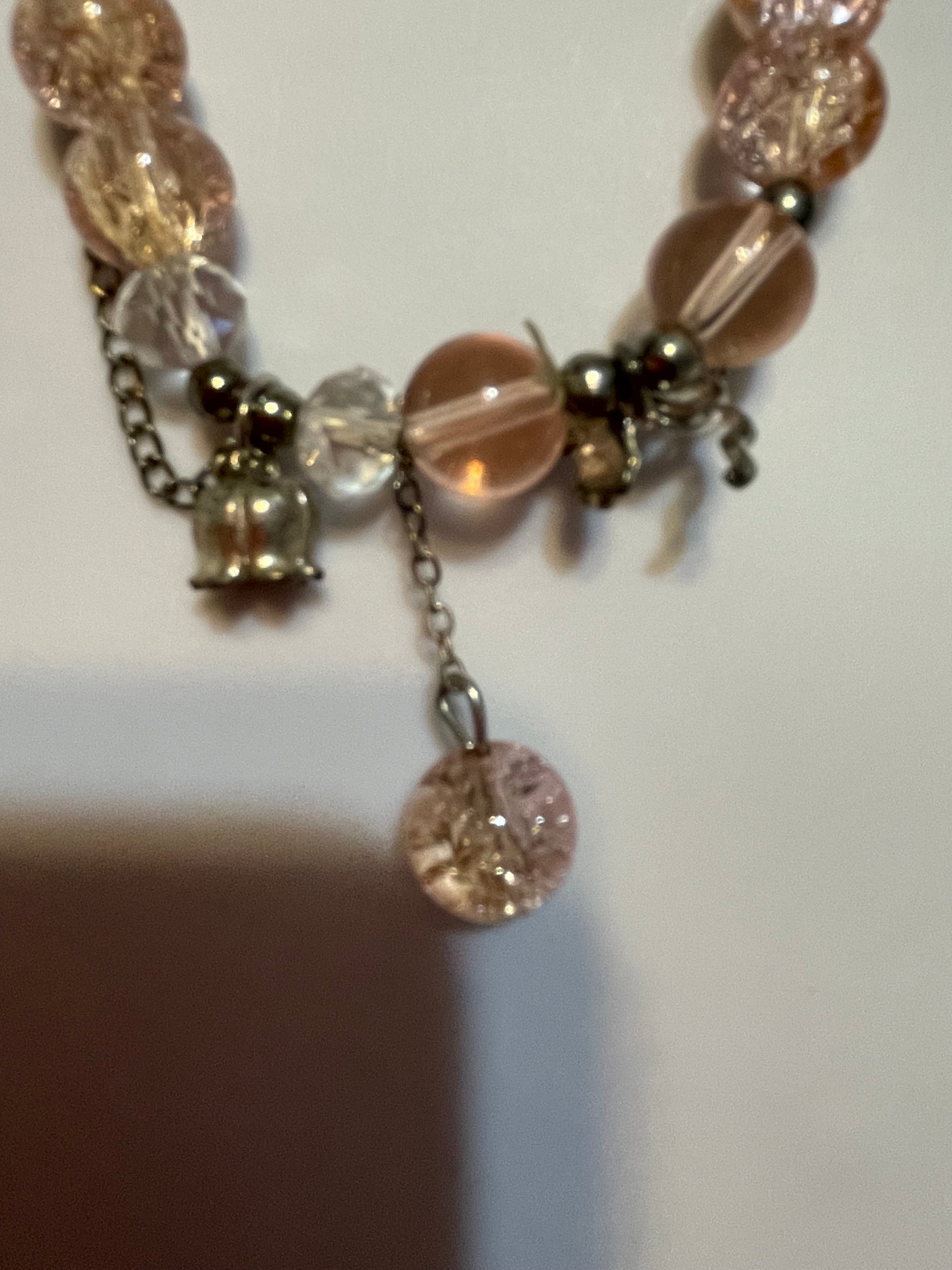 Bracelet with pink and clear beads.
