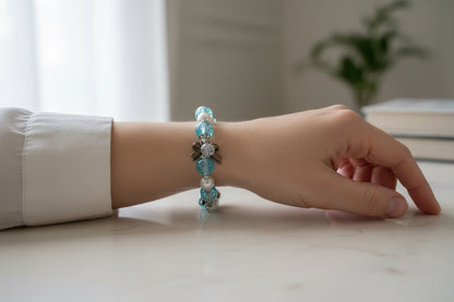 Beaded bracelet with blue, silver, and white beads.