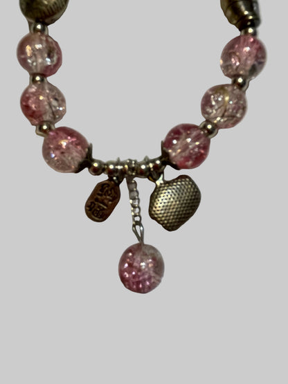 Bracelet with pink beads and metal clasp