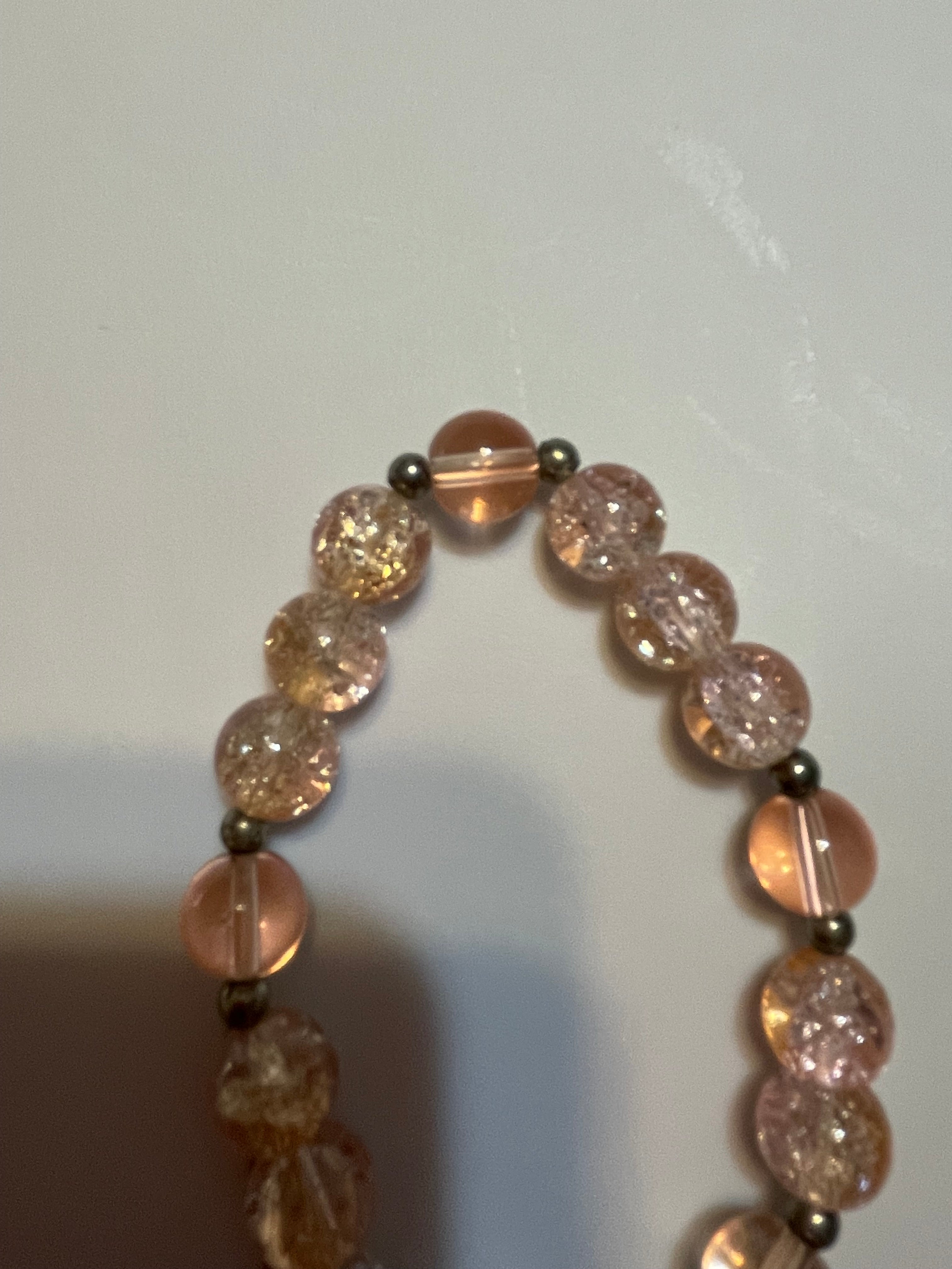 Bracelet with pink and clear beads.