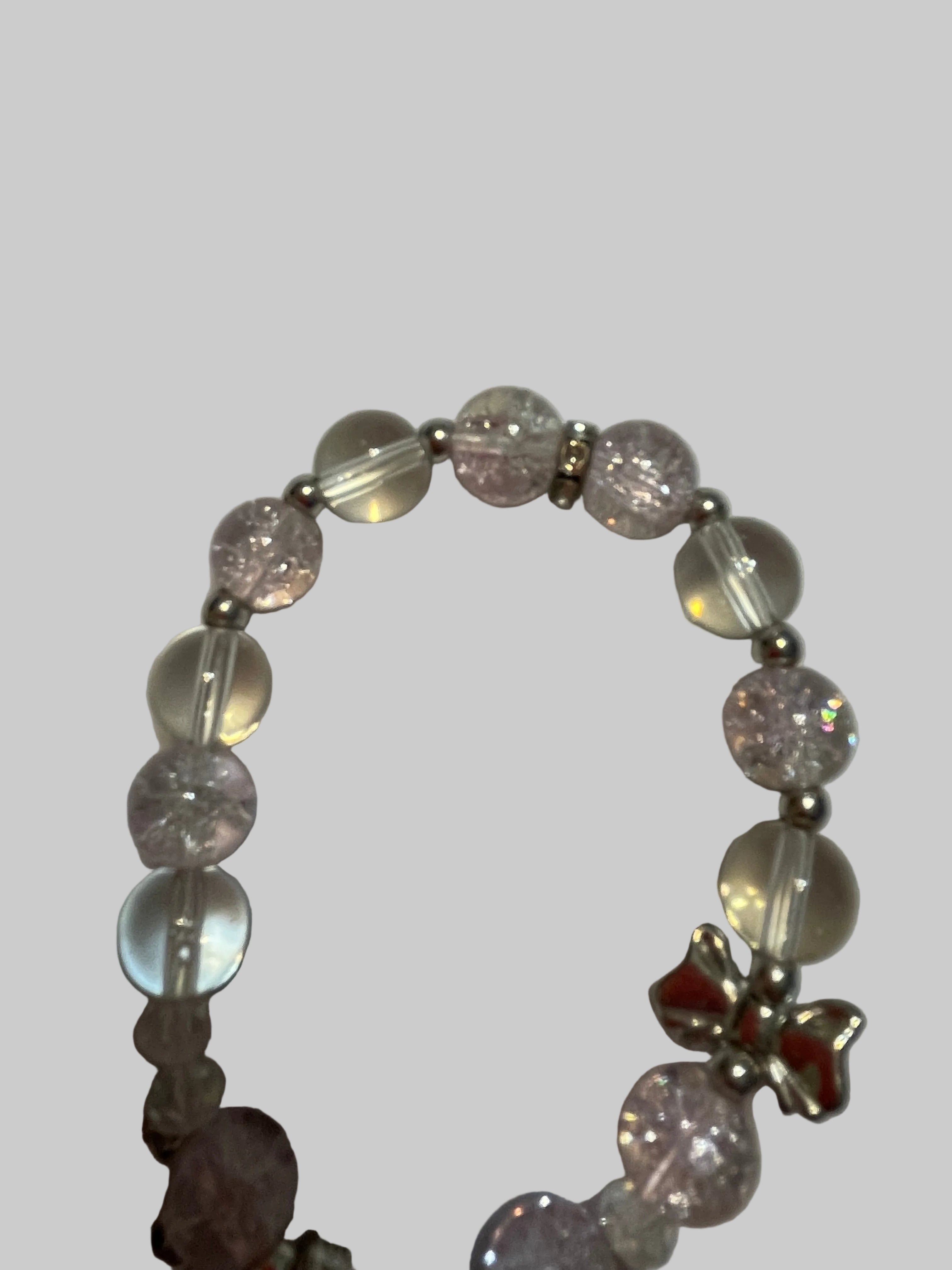 Bracelet with pink beads and silver charms