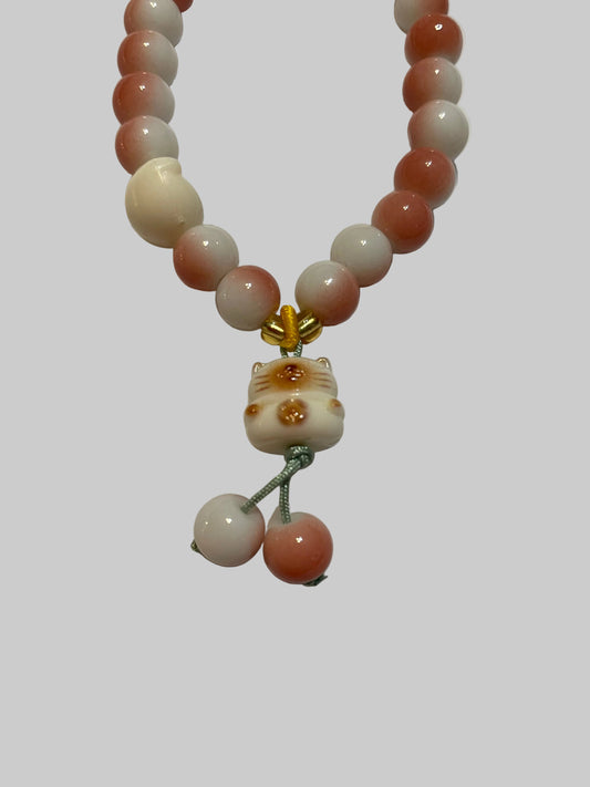 Pink and White beaded Bracelet with a bear charm