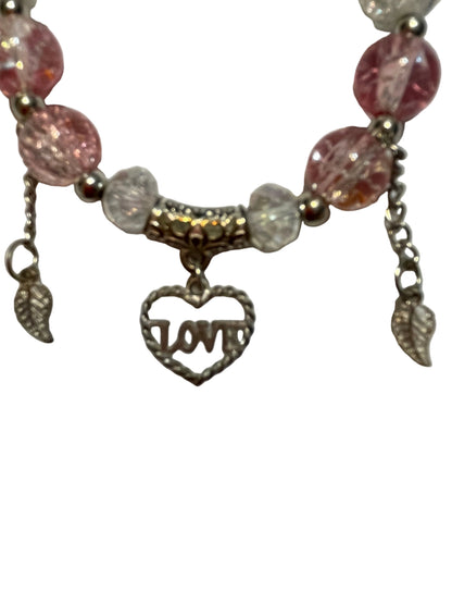 Bracelet with pink and clear beads and a 'LOVE' charm