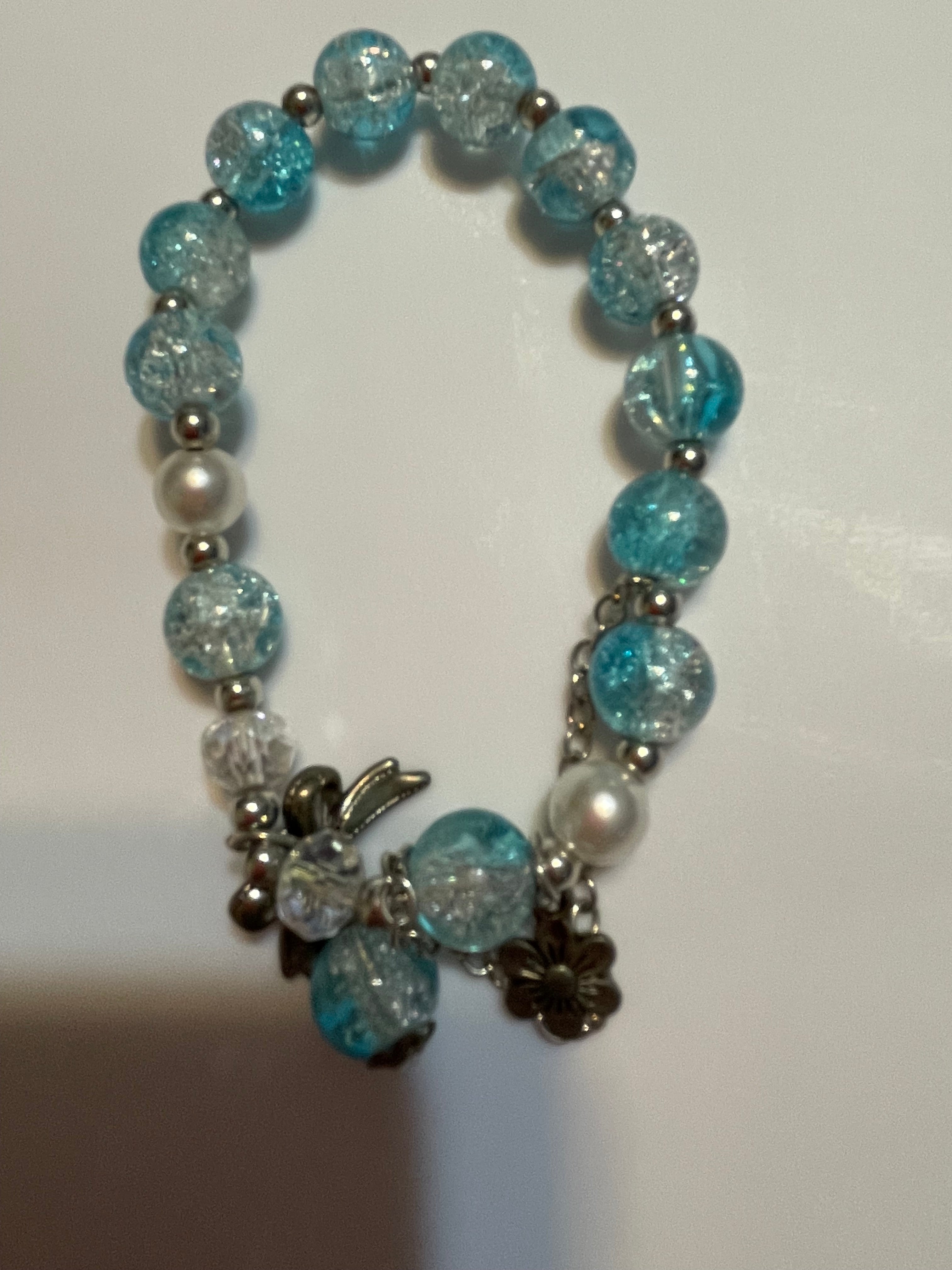 Beaded bracelet with blue, silver, and white beads.
