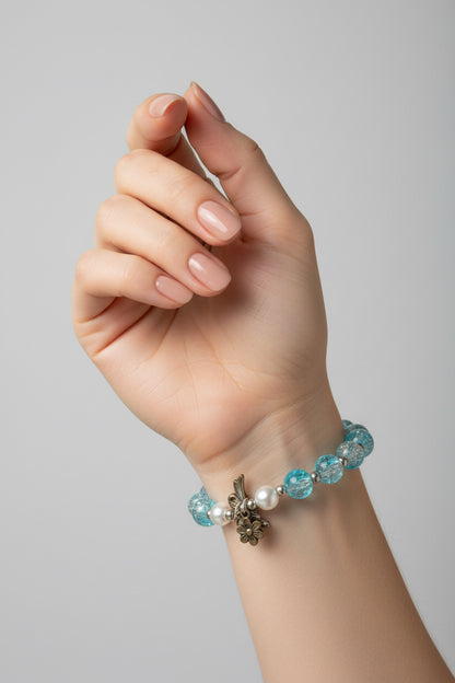 Beaded bracelet with blue, silver, and white beads.