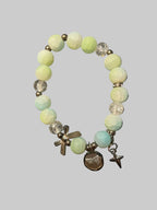 A bow and a butterfly charmed green bracelet